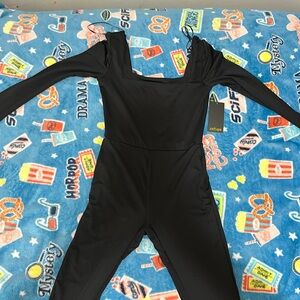 The brand is refuge and it’s black color jumpsuit